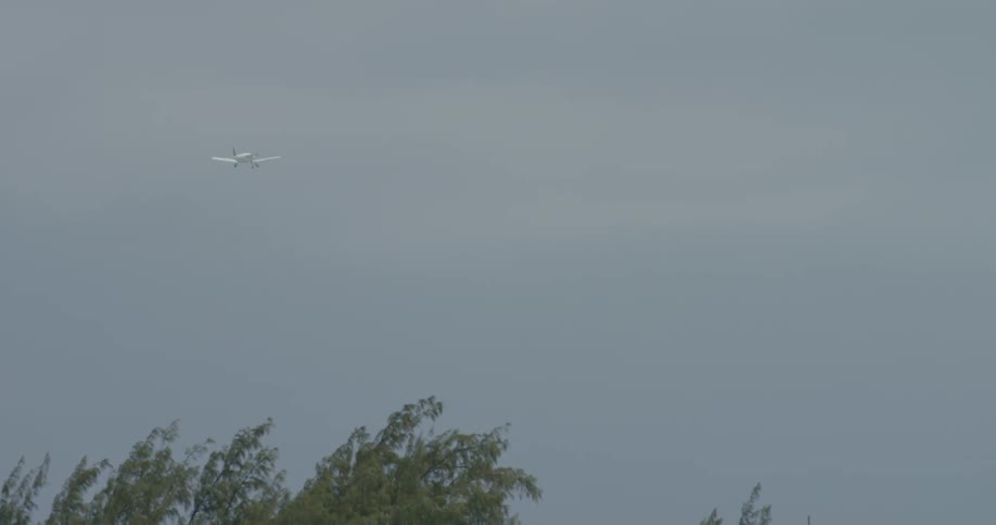 Airplane takes off in a cloudy sky