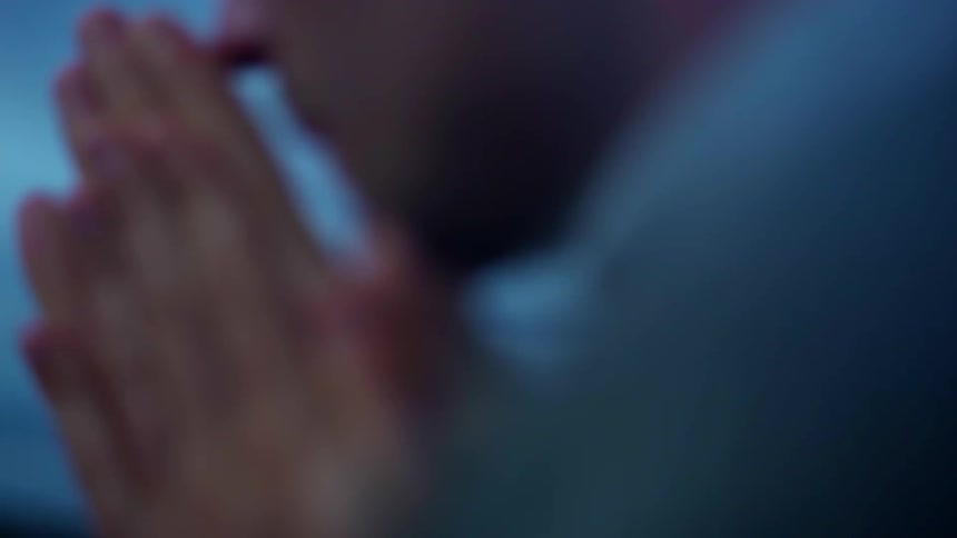 A man rubs his hands together