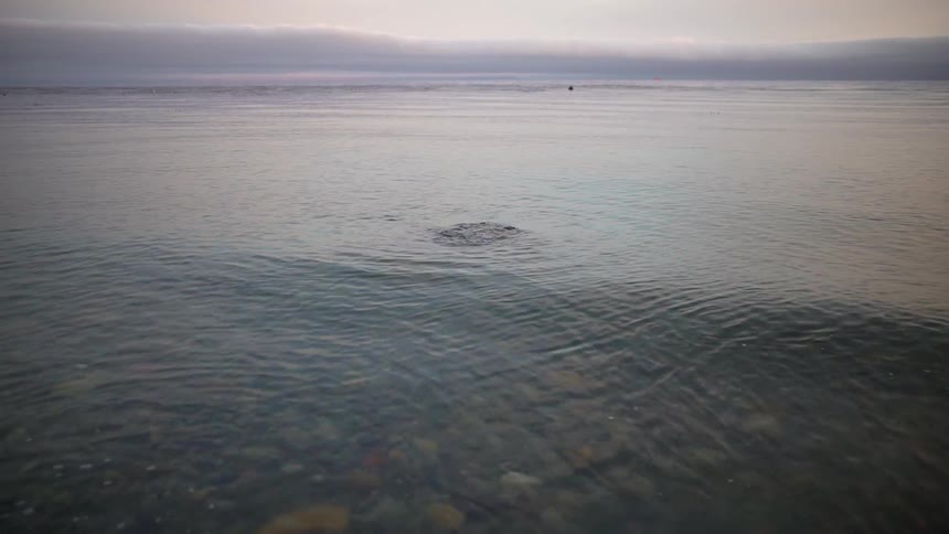 Water flows and splashes on a cloudy day