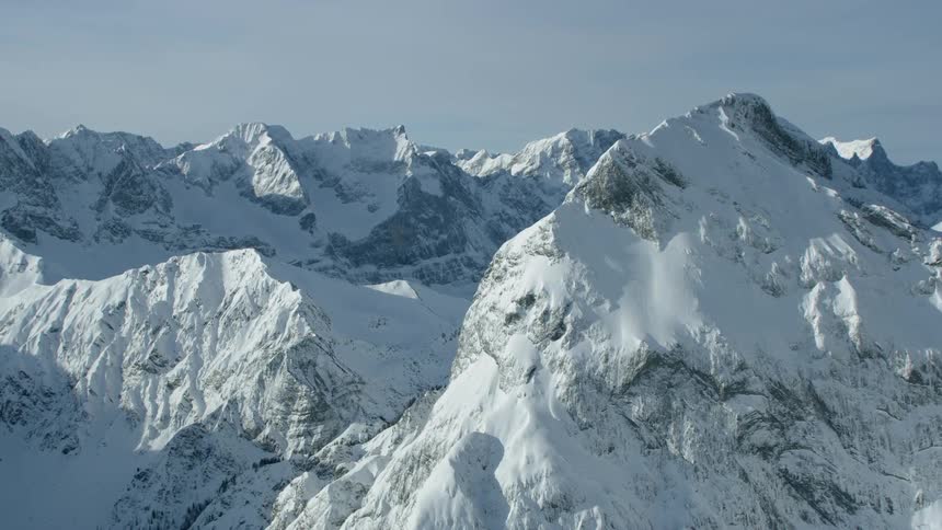 Snow covers a mountain ridge