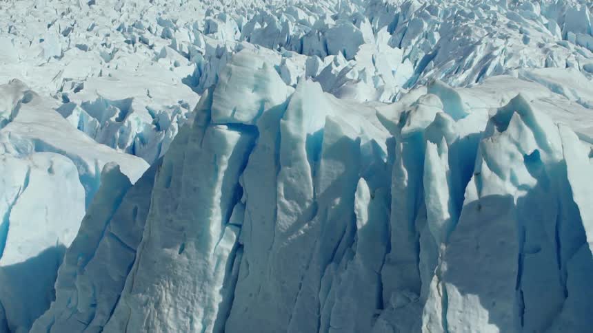 Tall jagged snow formations on a sunny day