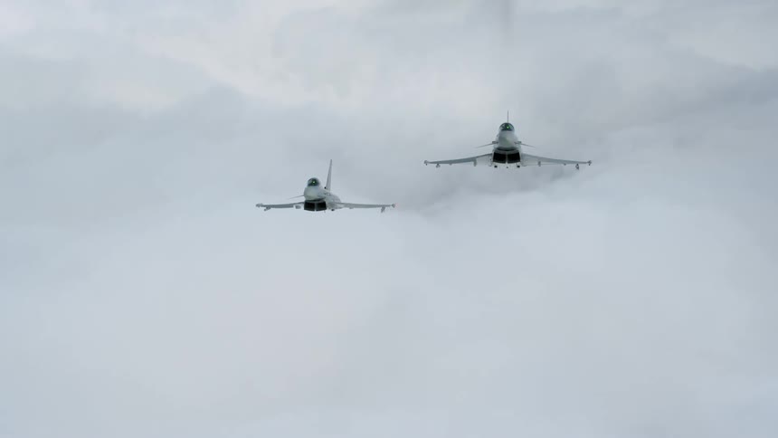 Jets fly above clouds in the sky