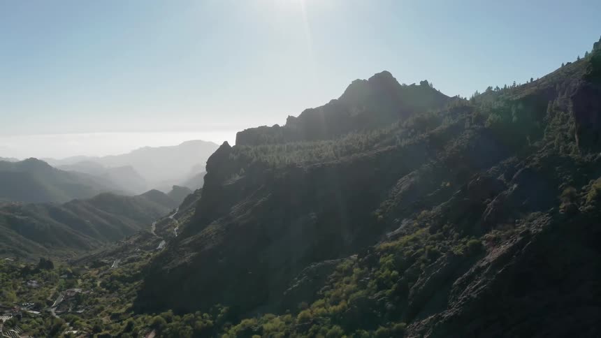 Tree covered hills and valley on a sunny day