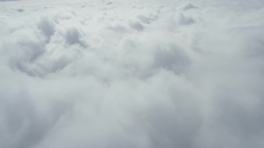 The large clouds move past the skyline