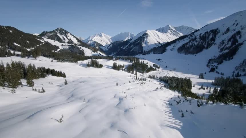 Snow covered mountains under a blue sky