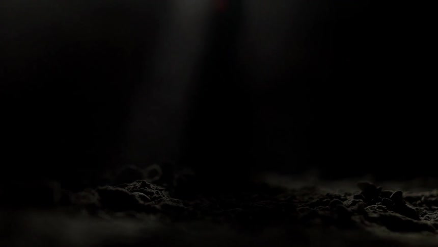 A hiker walks on dirt