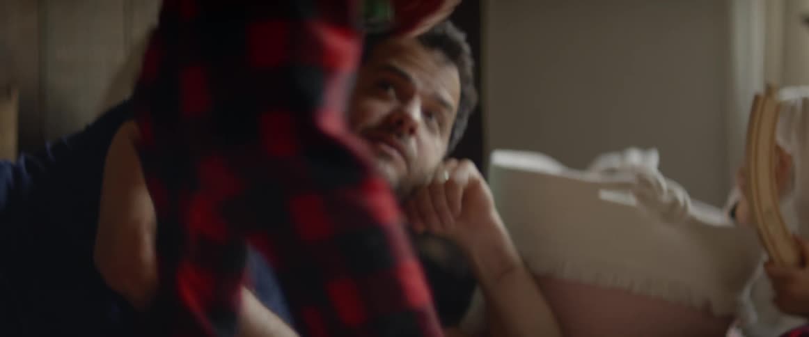 A boy gets up and moves closer to his dad