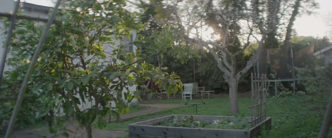The yard behind the home is empty