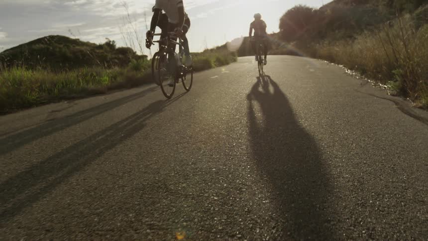 Bikers are biking down the hill