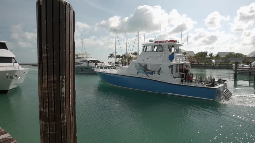 The boat leaves the docks on a cloudy day
