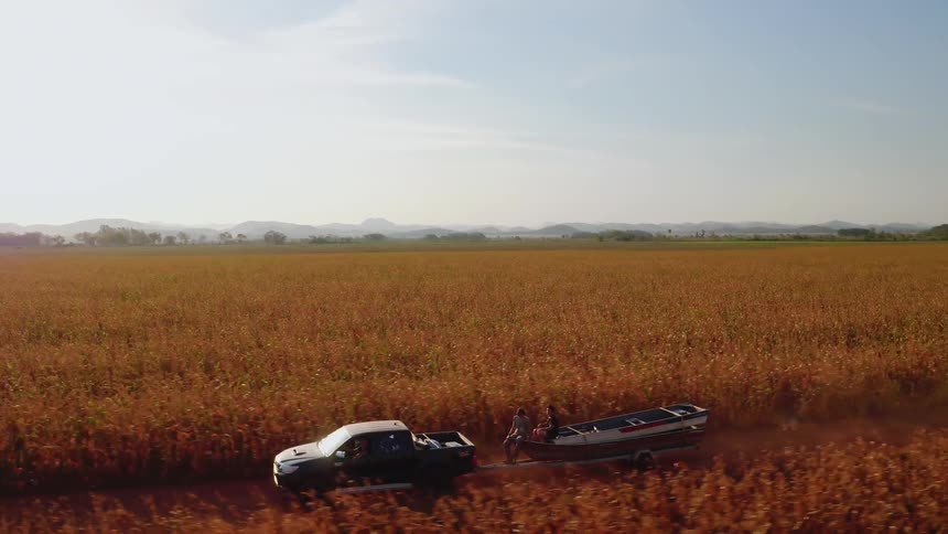 The truck pulls the boat down the trail