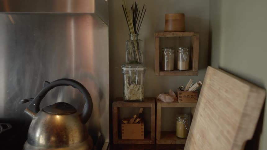 A teapot is shown inside a house