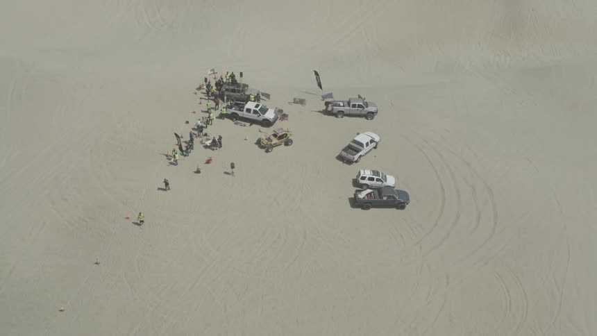 Aerial of a group of people in the desert