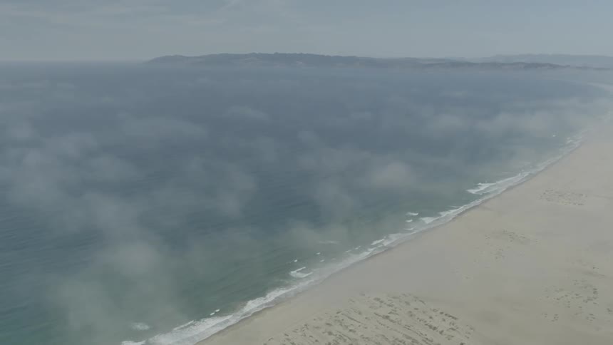 Waves crashing against the beach