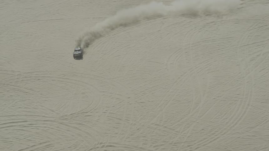 A car driving through the desert