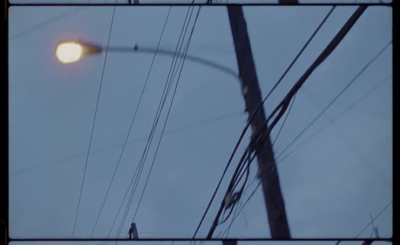 Power lines and street lights overhead