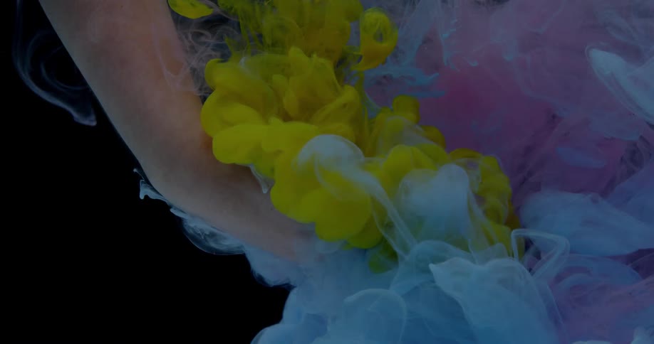 Yellow, blue and pink smoke fills water around an arm