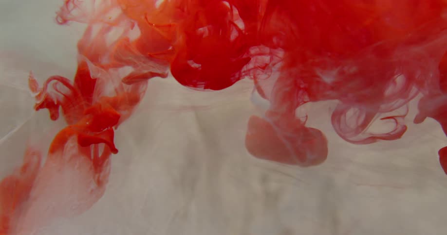 White and red ink move around in the water
