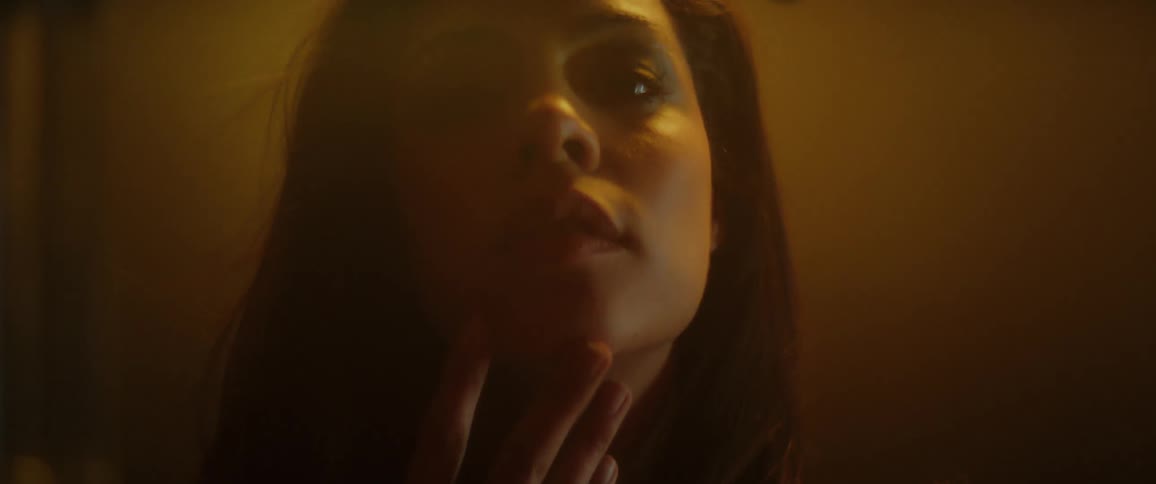 A model poses in a foggy room