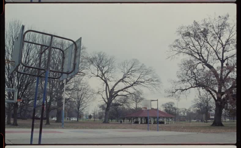 The basketball court is empty on a cloudy day
