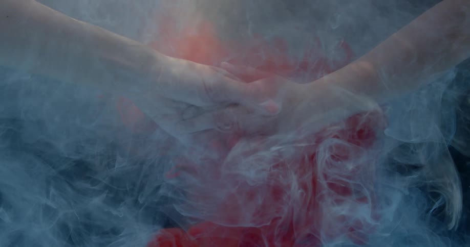 Two people hold hands in the murky water