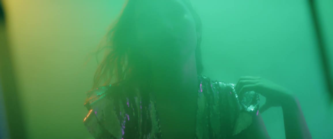 A model poses in a foggy room