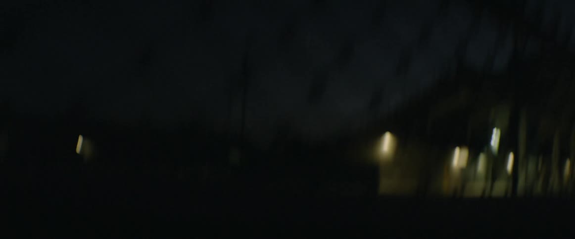 A person is running outside at night