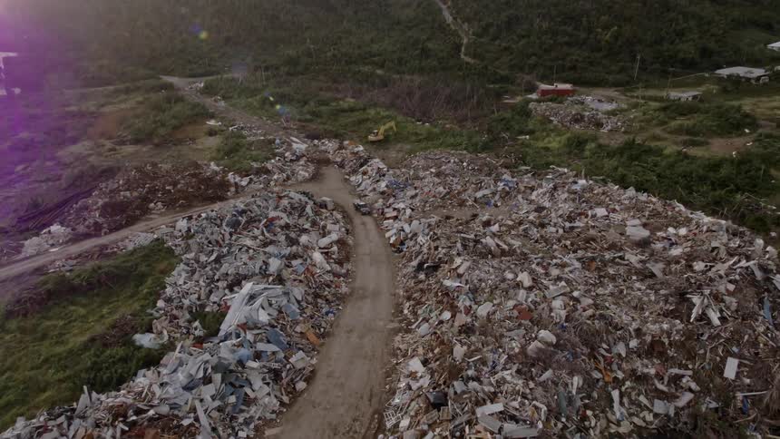 A trail runs through the debris below
