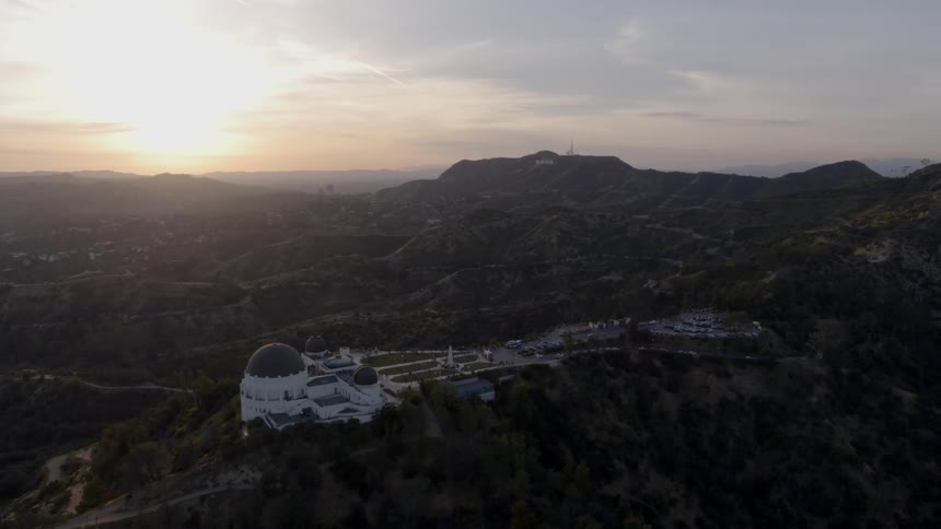 A building with a dome sits on the hillside