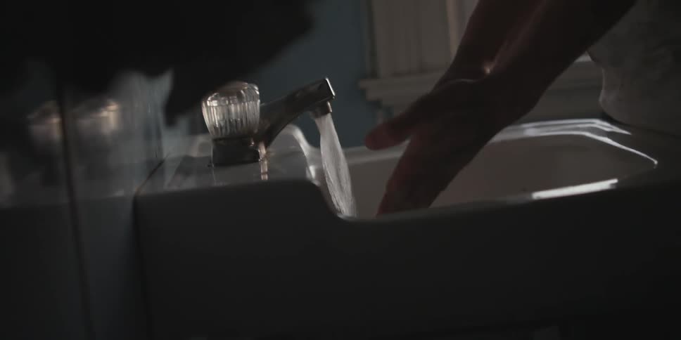 A person washing their hands