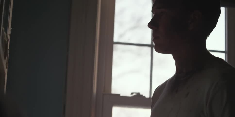 A man is covered in dirt inside his house