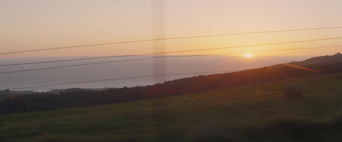 A car passes another on the side of the road