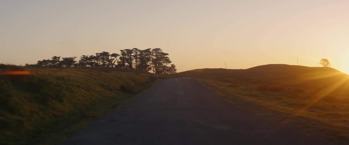 The sun shines on a rural road