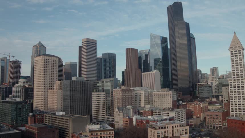 Fast push toward buildings, rooftops and skyscrapers of downtown Seattle