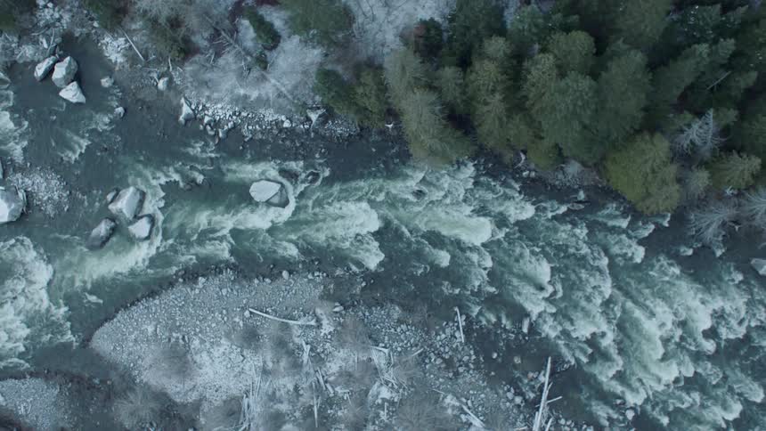 Top down traverse of a cold mountain valley whitewater river