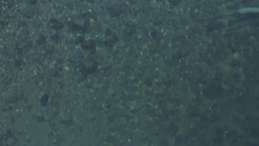 Top down view of calm clear and cold river water