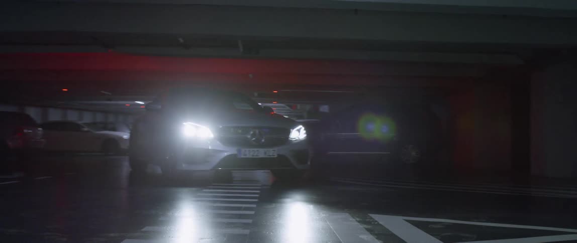 A car drives in a parking garage