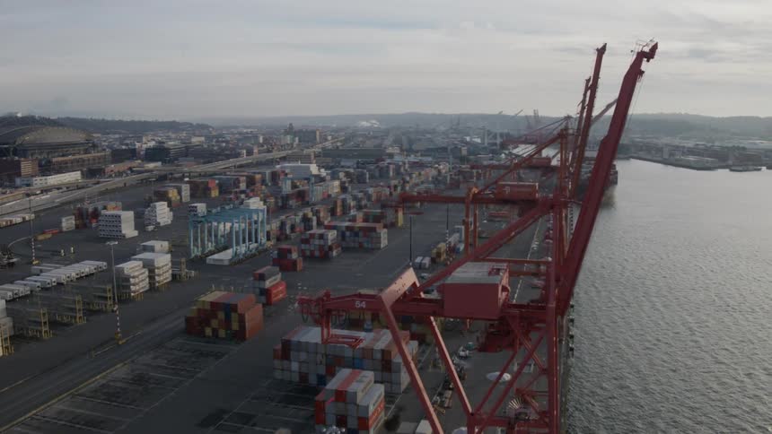Wrapping around tall cranes at a Port of Seattle shipping terminal