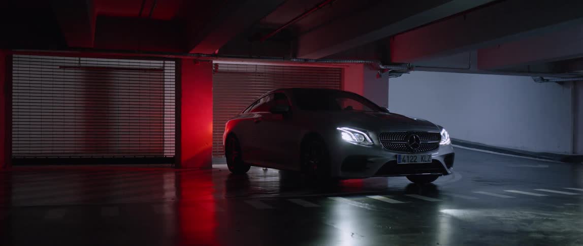 A car is parked in a parking garage