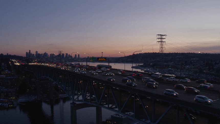 Converging with heavy traffic on a double decker bridge at dusk