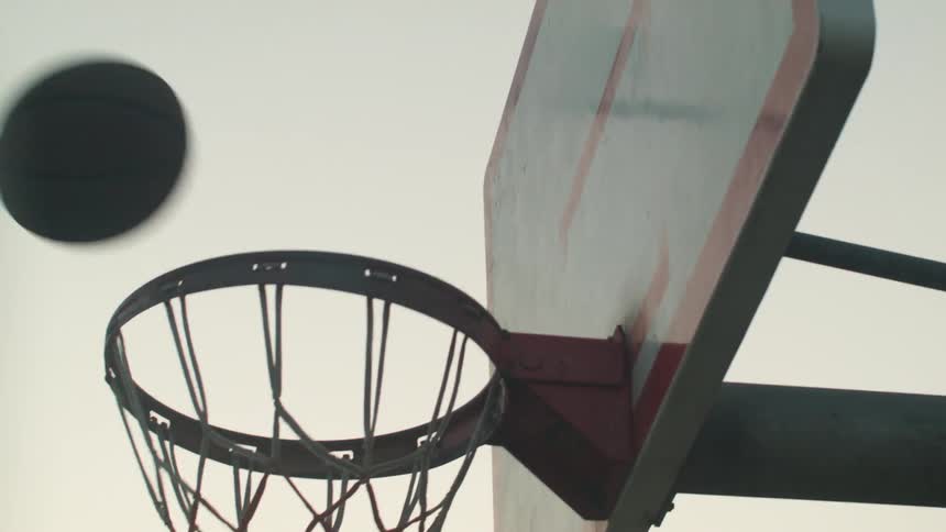 A basketball bounces off of a basketball hoop