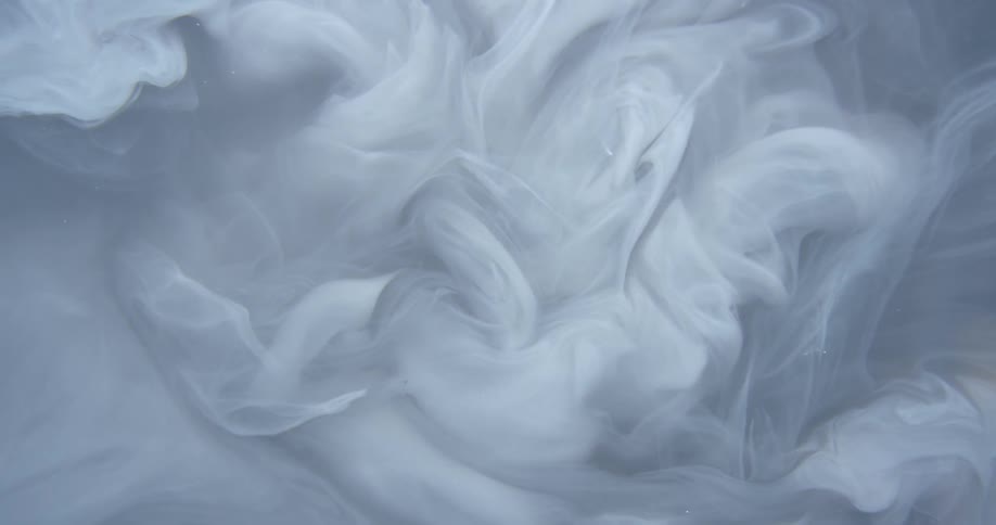 Smoke curls across a gray background