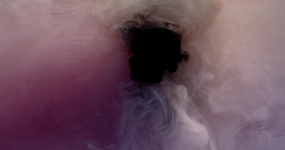 A person mixes ink in the tank
