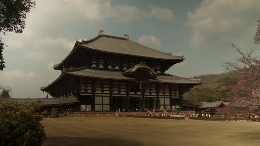 Oriental building sits under a cloudy blue sky