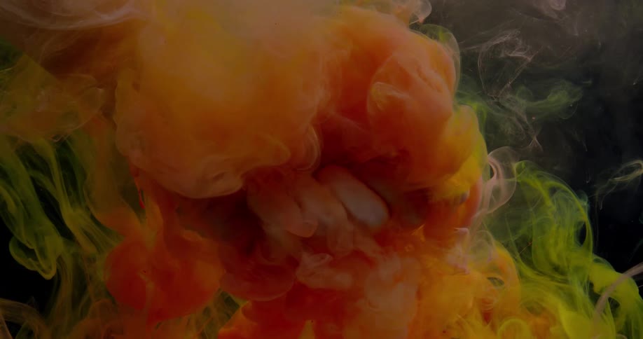 Fingers grasp colored wisps of smoke