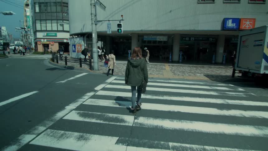Pedestrians cross a city street