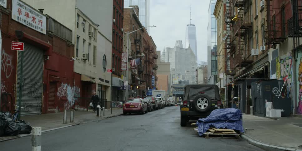 Cars are parked on a city street