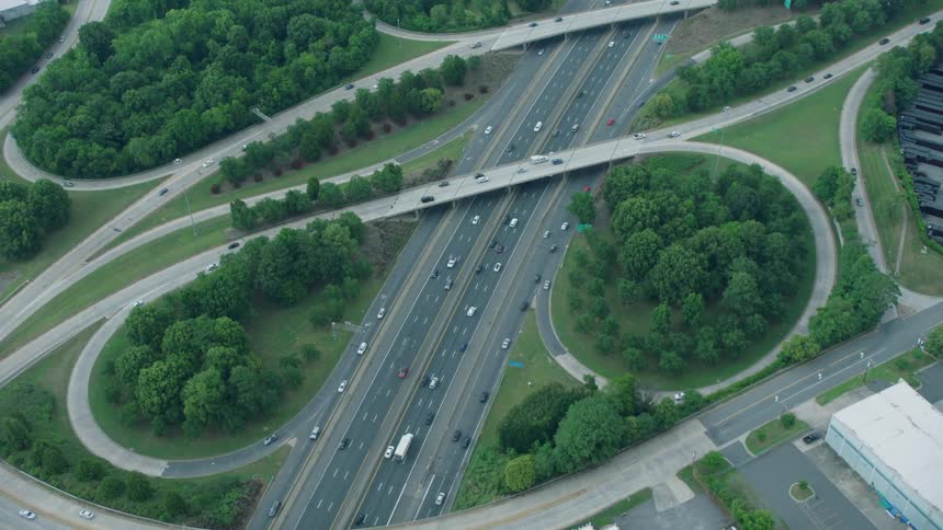 The vehicles all travel on the highway below