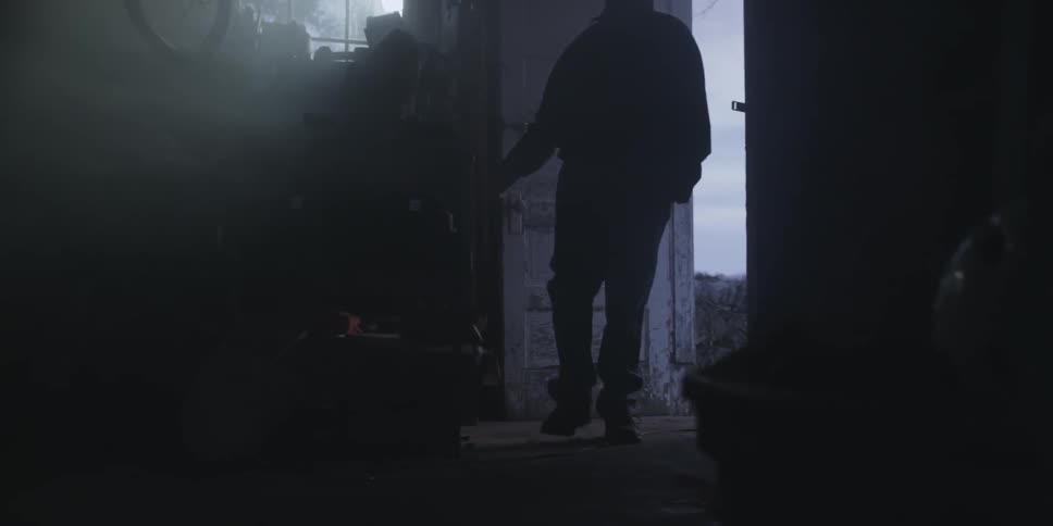 Person opens the door and enters a dark room
