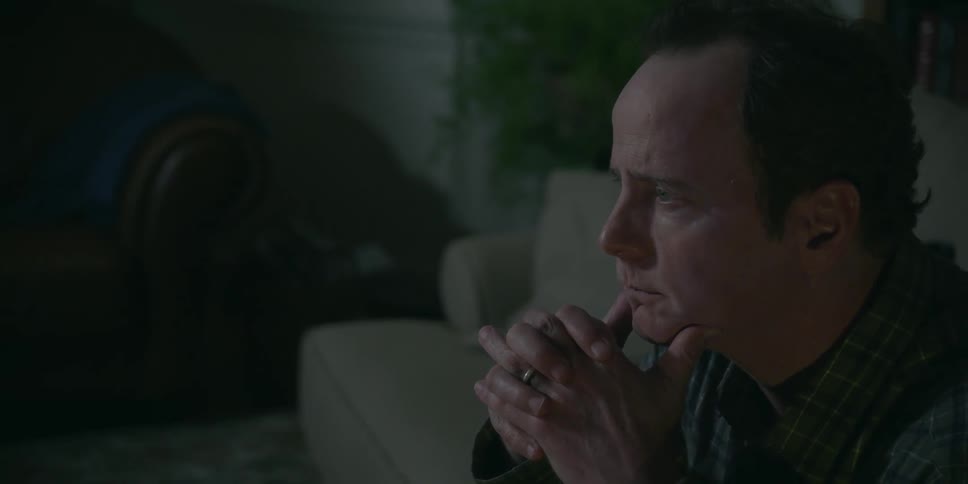 A man is thinking in his home